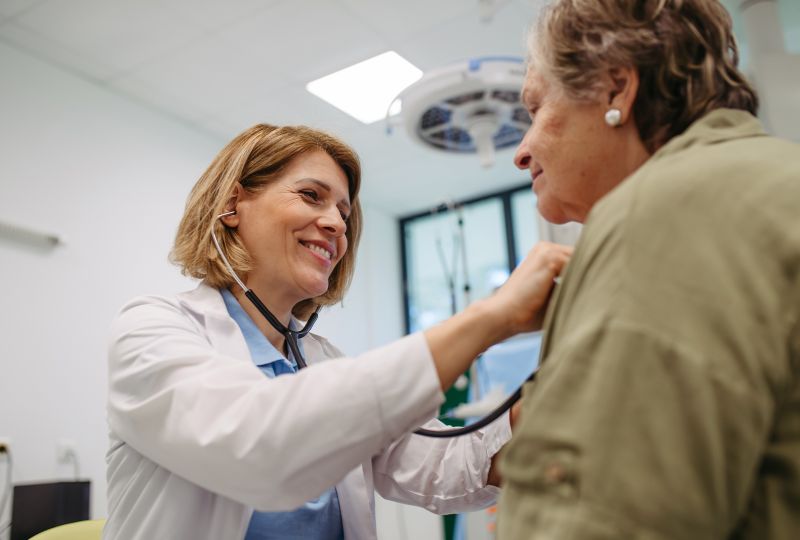 Doctor examining patient with a stethoscope