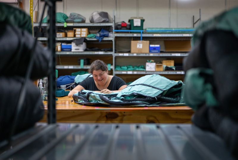 Vivax worker stitching Soma Safe Enclosure